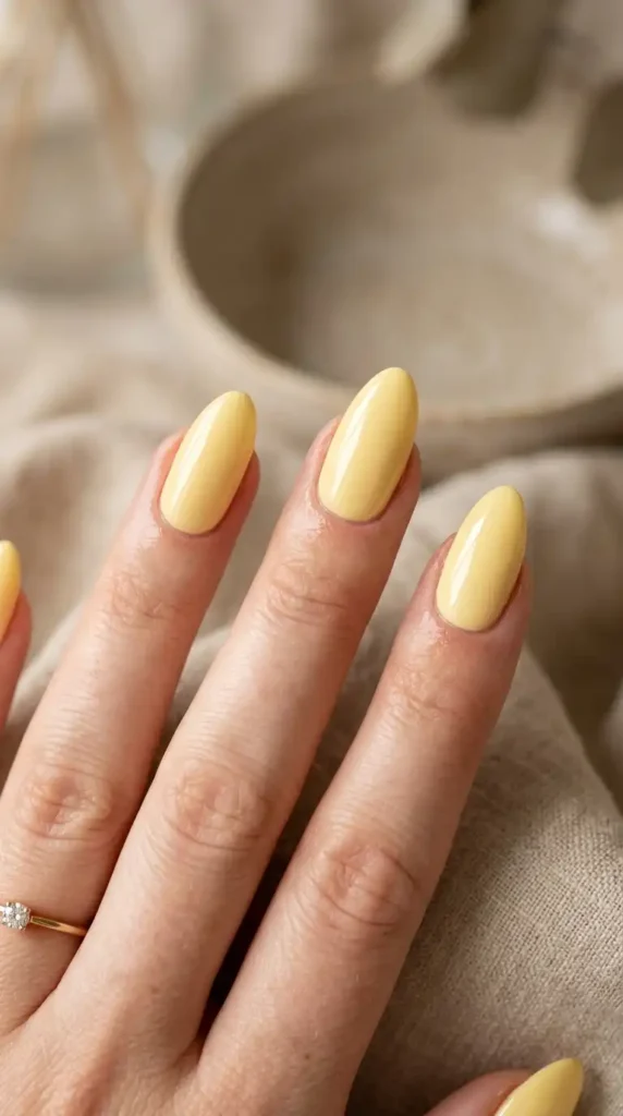 Yellow Nail Ideas: 20 Trendy Designs That Brighten Every Season butter yellow almond nails 202605100940 optimized