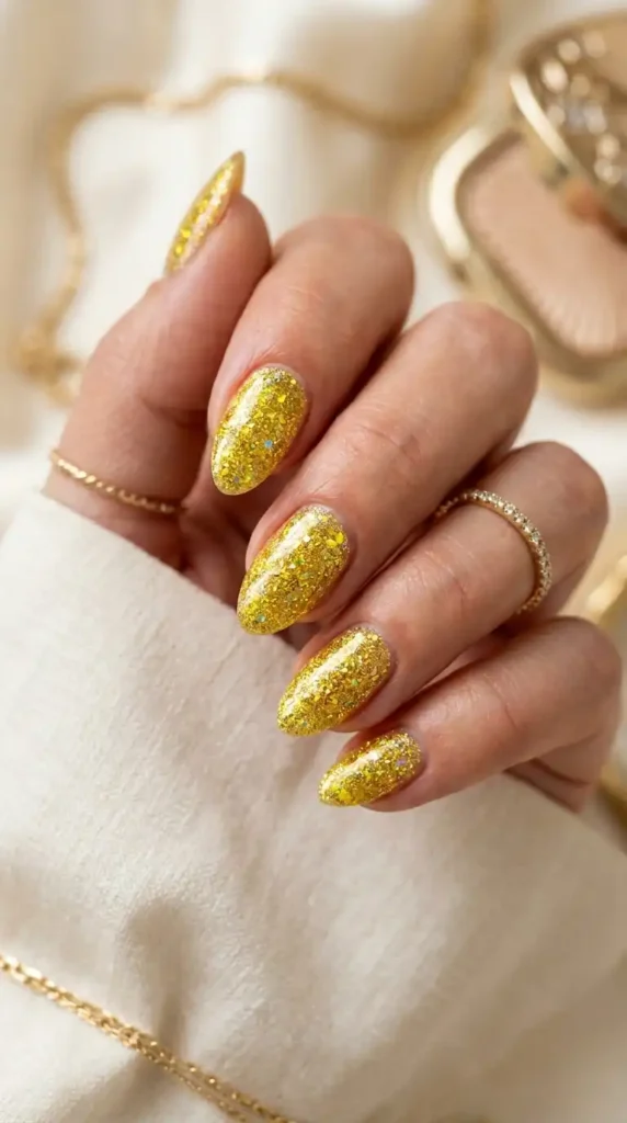Yellow Nail Ideas: 20 Trendy Designs That Brighten Every Season yellow glitter nails gold shimmer 202605102115 optimized